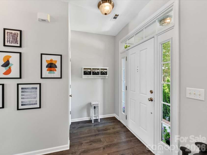 15224 Waterfront Drive, Huntersville, NC 28078.  MLS# CAR4374936, YatesRealty ID 24231. Bright and welcoming foyer featuring hardwood floors, abundant natural light, and a stylish, open entry that flows seamlessly into the main living areas.