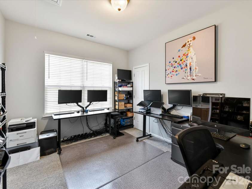 15224 Waterfront Drive, Huntersville, NC 28078.  MLS# CAR4374936, YatesRealty ID 24231. Spacious third bedroom offering versatile use as a home office or guest space, complete with ample natural light and flexible layout options.