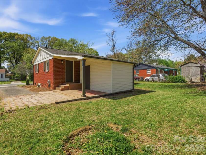 4946 Morgan Street, Charlotte, NC 28208.  MLS# CAR4361415, YatesRealty ID 24232. Does your apartment have a back yard like this? And storage galore? 