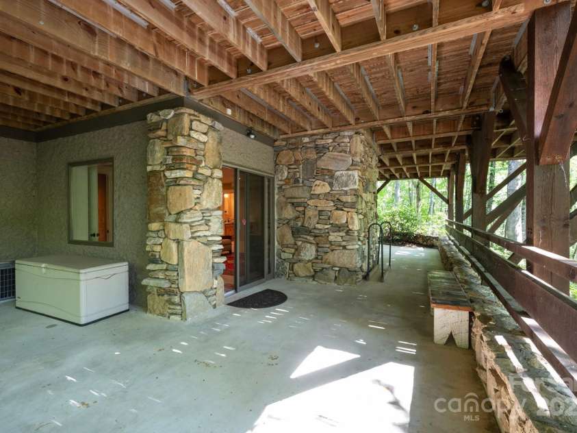 151 Sanctuary Drive, Burnsville, NC 28714.  MLS# CAR4276190, YatesRealty ID 24235. Basement Concrete Patio Also Overlooks the River