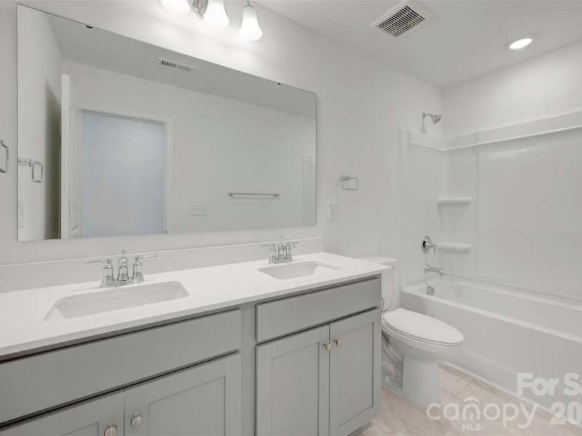 1317 Fremont Drive, Wingate, NC 28174.  MLS# CAR4368117, YatesRealty ID 24236. Secondary bathroom