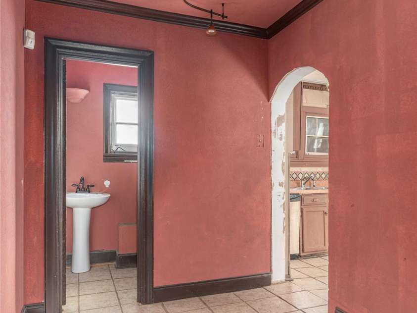202 Alexander Avenue, Swannanoa, NC 28778.  MLS# CAR4234591, YatesRealty ID 2424. Central hall between kitchen and living room with half bath and tile floor
