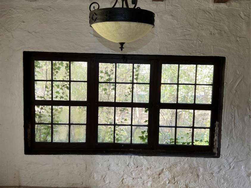 202 Alexander Avenue, Swannanoa, NC 28778.  MLS# CAR4234591, YatesRealty ID 2424. Original hammered chandelier