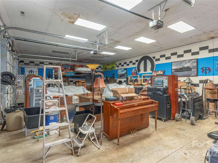 202 Alexander Avenue, Swannanoa, NC 28778.  MLS# CAR4234591, YatesRealty ID 2424. Spacious 3 car garage with shop and lift.