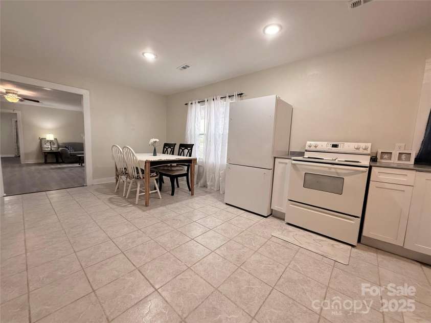 3465 Peniel Road, Tryon, NC 28782.  MLS# CAR4213034, YatesRealty ID 24241. Laundry room and backyard access to the left; wide open kitchen if you wanted a larger table or bar/island!