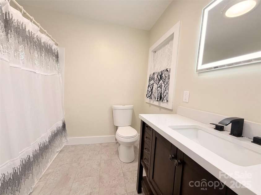 3465 Peniel Road, Tryon, NC 28782.  MLS# CAR4213034, YatesRealty ID 24241. Main bathroom/guests