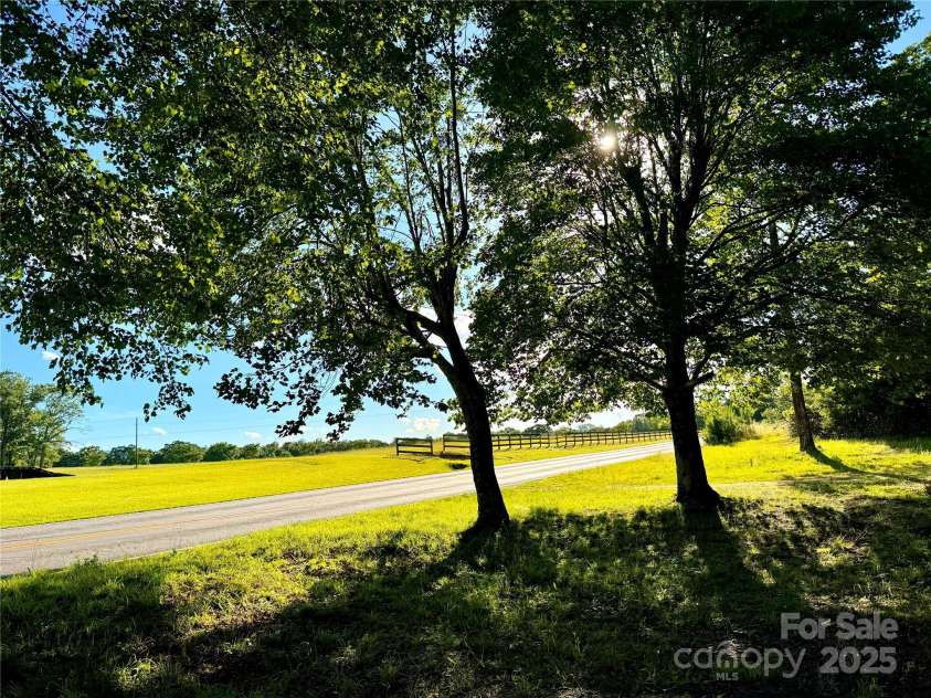 3465 Peniel Road, Tryon, NC 28782.  MLS# CAR4213034, YatesRealty ID 24241. View off the front porch! Winter sunset mountain long range views! (**Outside to be painted or negotiated if prior)