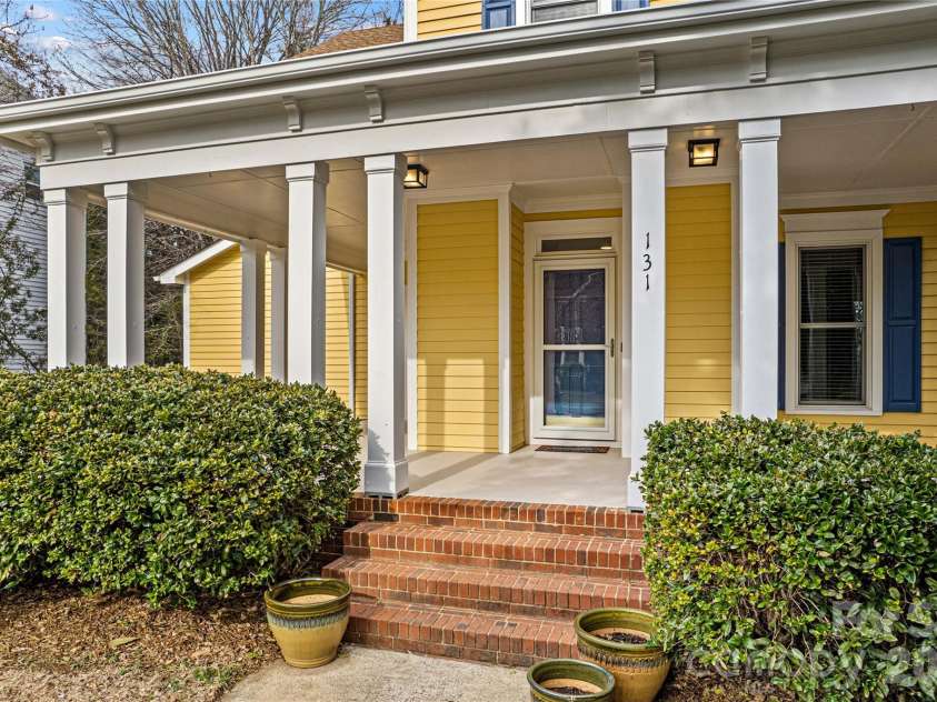 131 Morrison Hill Road, Davidson, NC 28036.  MLS# CAR4347285, YatesRealty ID 24245. The wrap-around front porch greets you into this charming home.