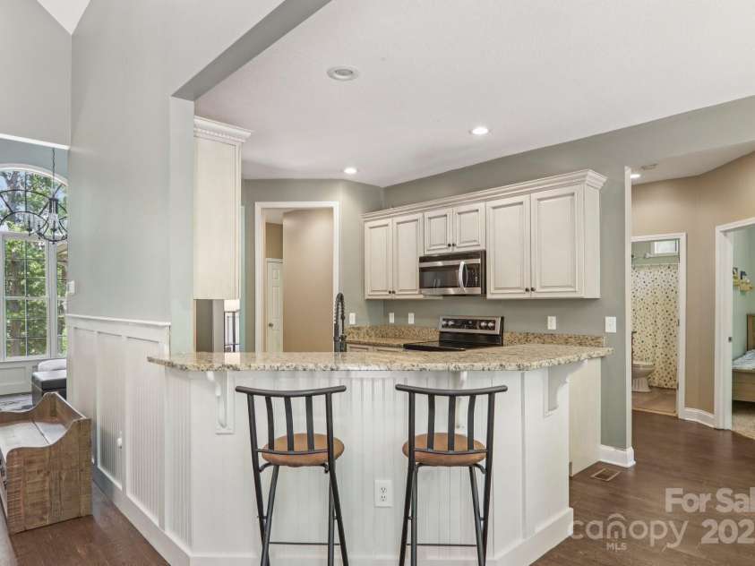 351 Rambling Creek, Tryon, NC 28782.  MLS# CAR4267744, YatesRealty ID 24276. Bar area in Kitchen