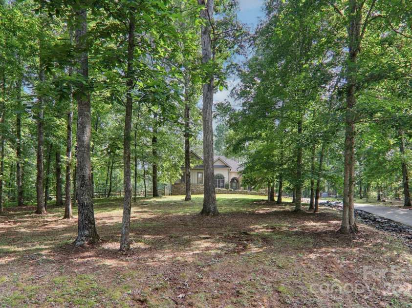 351 Rambling Creek, Tryon, NC 28782.  MLS# CAR4267744, YatesRealty ID 24276. Front of house from the street