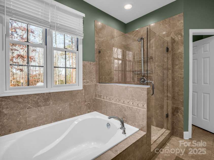 351 Rambling Creek, Tryon, NC 28782.  MLS# CAR4327105, YatesRealty ID 24276. Relax in the soaking tub