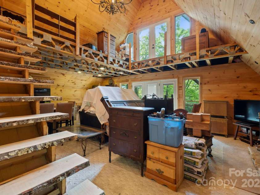 193 Falls View Drive, Lake Toxaway, NC 28747.  MLS# CAR4267831, YatesRealty ID 24289. Family room - view from front door