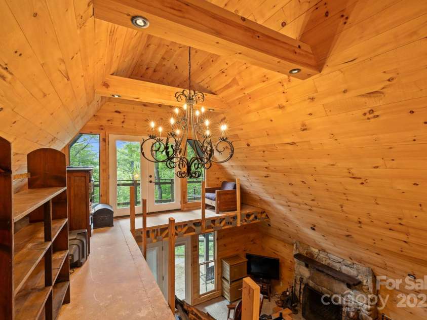 193 Falls View Drive, Lake Toxaway, NC 28747.  MLS# CAR4267831, YatesRealty ID 24289. Loft with doors to the upper deck