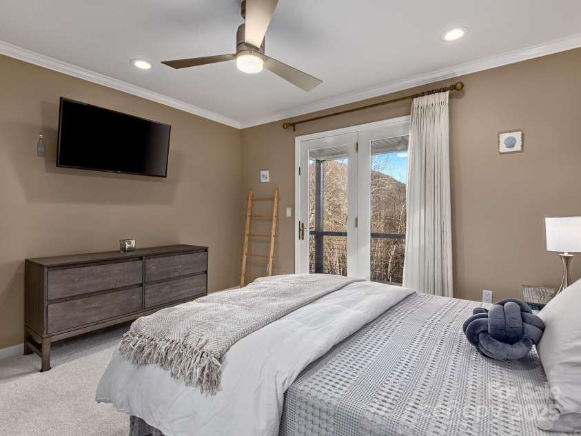 1591 Chestnut Flats Lane, Waynesville, NC 28786.  MLS# CAR4330210, YatesRealty ID 24293. Guest Bedroom with Deck Access and Mountain Views