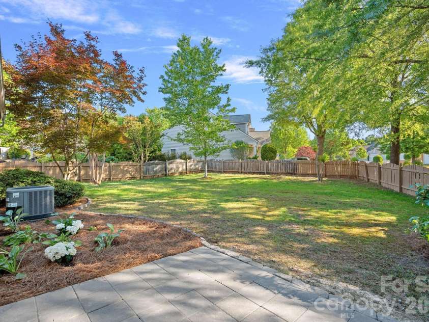 6902 Saranac Lane, Matthews, NC 28105.  MLS# CAR4368511, YatesRealty ID 24299. Paved Patio