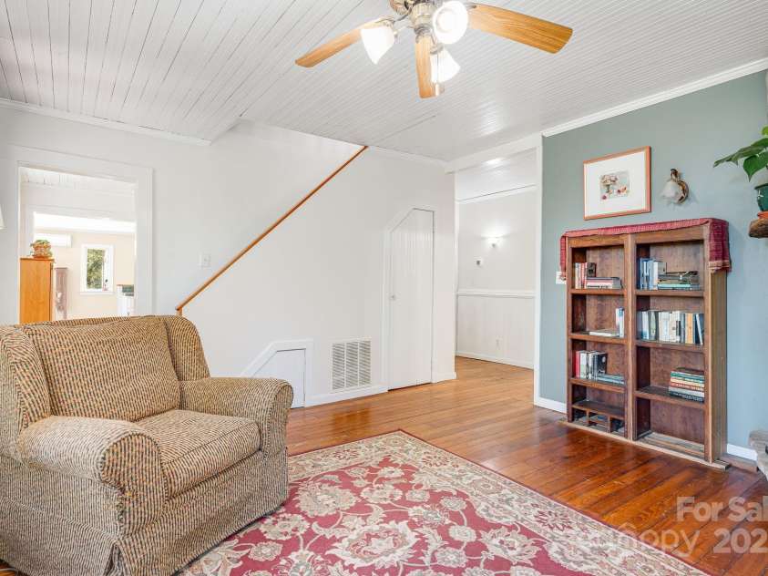3942 Anderson Branch Road, Marshall, NC 28753.  MLS# CAR4194883, YatesRealty ID 243. Living room with wood buring fireplace