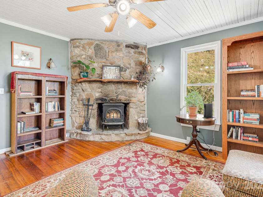 3942 Anderson Branch Road, Marshall, NC 28753.  MLS# CAR4194883, YatesRealty ID 243. Living room with wood burning fireplace