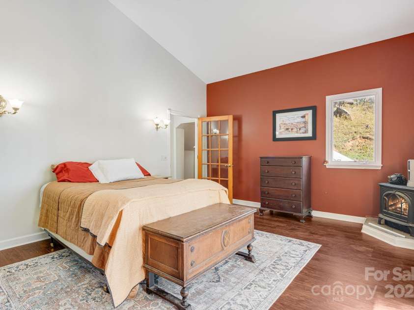 3942 Anderson Branch Road, Marshall, NC 28753.  MLS# CAR4194883, YatesRealty ID 243. Primary bedroom with gas logs to keep you warm in the winter.