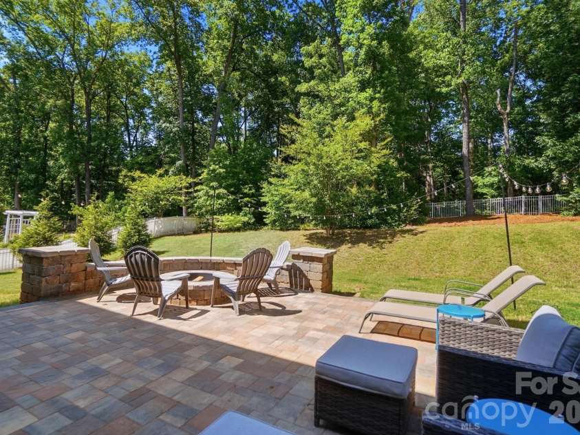 2613 Sugaree Court, Waxhaw, NC 28173.  MLS# CAR4381189, YatesRealty ID 24302. Extra large paver patio with built-in firepit