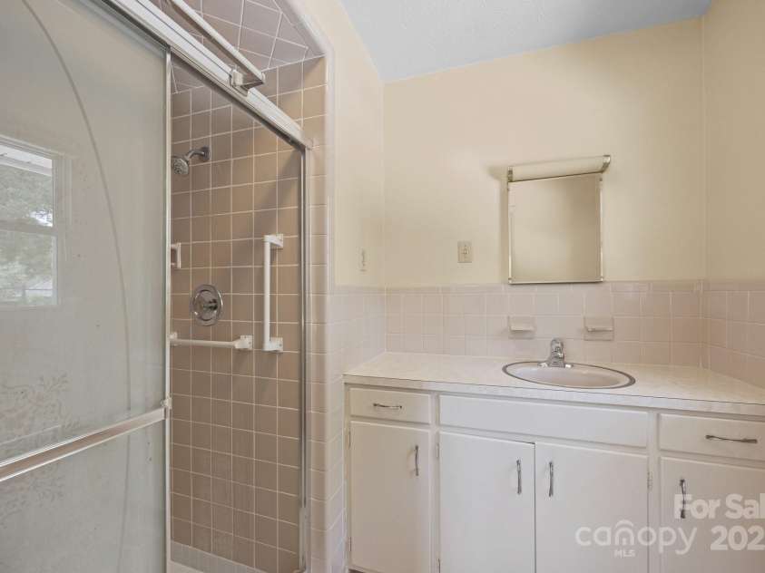 49 Greenwood Road, Asheville, NC 28803.  MLS# CAR4267926, YatesRealty ID 24306. Bathroom off Bedroom