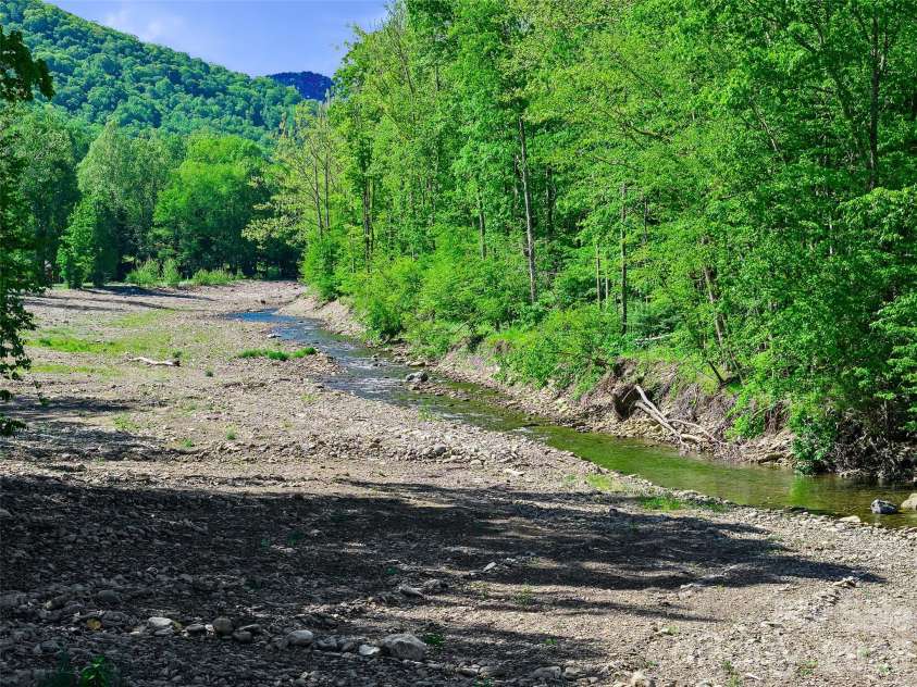 326 Ewart Wilson Road, Burnsville, NC 28714.  MLS# CAR4380347, YatesRealty ID 24308. Private river access