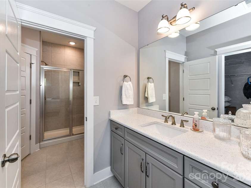 5129 Devonshire Road, Denver, NC 28037.  MLS# CAR4275511, YatesRealty ID 24318. Jack & Jill Bath with quartz vanity, tub/shower & tile floors!