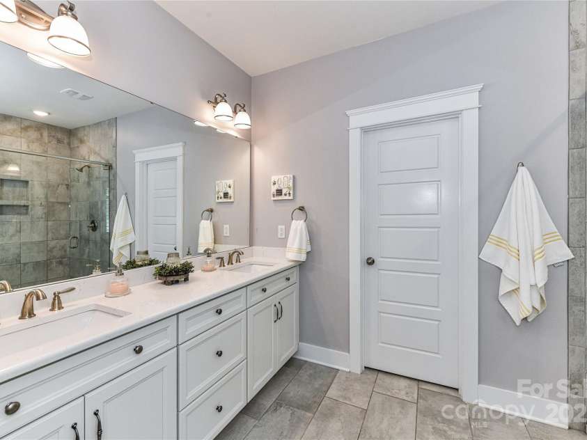 5129 Devonshire Road, Denver, NC 28037.  MLS# CAR4275511, YatesRealty ID 24318. Primary Bath with dual, quartz counters, tiled shower, garden tub & tile floors!