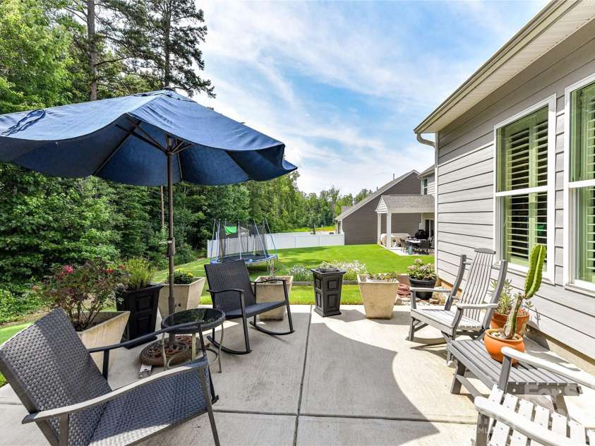 5129 Devonshire Road, Denver, NC 28037.  MLS# CAR4275511, YatesRealty ID 24318. Spacious Patio great for relaxing & enjoying your wooded back yard views!