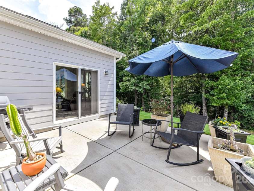 5129 Devonshire Road, Denver, NC 28037.  MLS# CAR4275511, YatesRealty ID 24318. Spacious Patio great for relaxing & enjoying your wooded back yard views!
