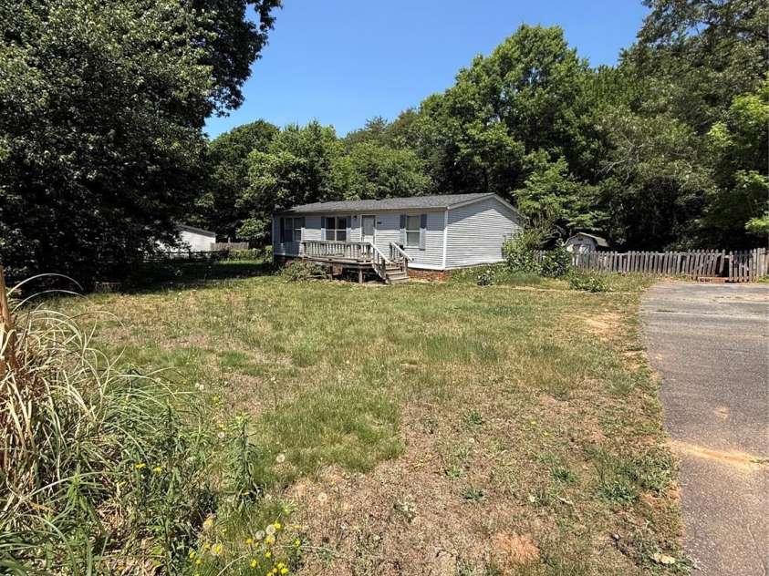 6237 Burnhurst Lane, Denver, NC 28037.  MLS# CAR4384264, YatesRealty ID 24318. 1/2 acre, level lot with privacy trees