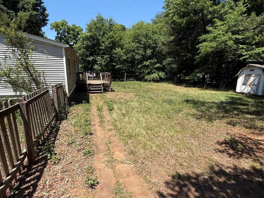 6237 Burnhurst Lane, Denver, NC 28037.  MLS# CAR4384264, YatesRealty ID 24318. Rear deck with paver path. 
