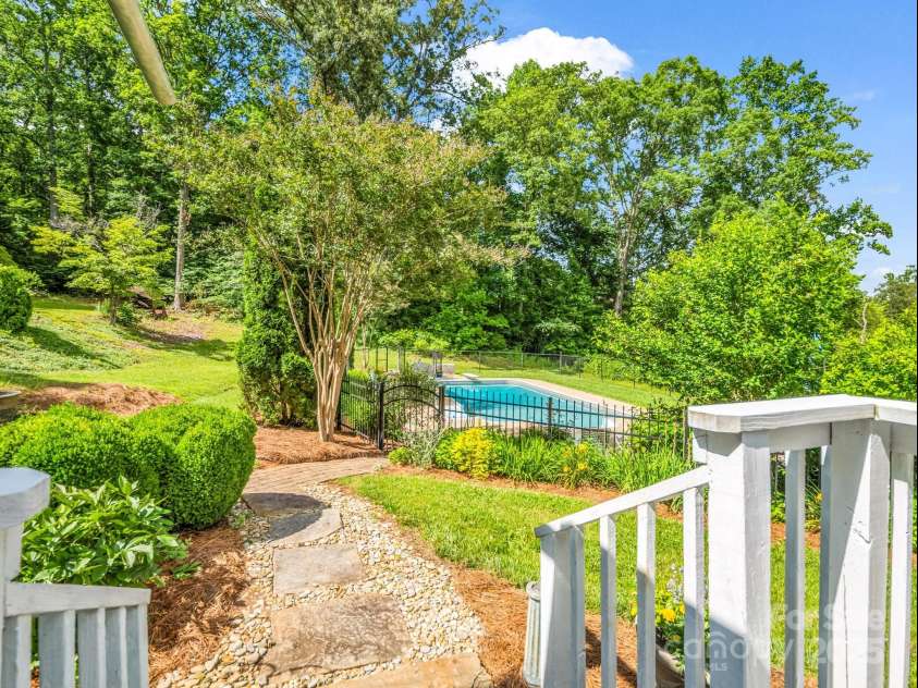 1111 Bills Creek Road, Lake Lure, NC 28746.  MLS# CAR4273811, YatesRealty ID 24320. Path to pool from deck