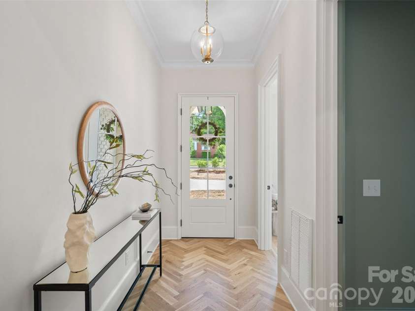 709 Norris Avenue, Charlotte, NC 28206.  MLS# CAR4380495, YatesRealty ID 24324. Herringbone hardwood entry