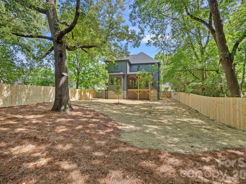 709 Norris Avenue, Charlotte, NC 28206.  MLS# CAR4380495, YatesRealty ID 24324. Surrounded by mature trees for extra privacy