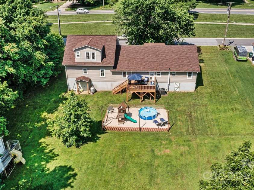 454 Eastway Drive, Troutman, NC 28166.  MLS# CAR4263950, YatesRealty ID 24330. Back of home offers great space to play and entertain.