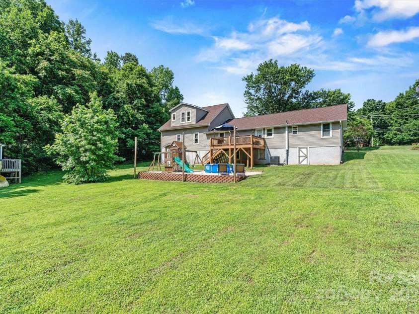 454 Eastway Drive, Troutman, NC 28166.  MLS# CAR4263950, YatesRealty ID 24330. Back of home offers great space to play and entertain. .93 acre lot that backs to Troutman ESC Park. NO HOA!!!