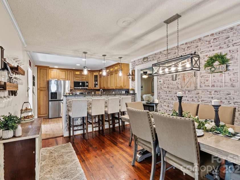 454 Eastway Drive, Troutman, NC 28166.  MLS# CAR4263950, YatesRealty ID 24330. Dining area opens to wonderful chefs kitchen and breakfast bar.