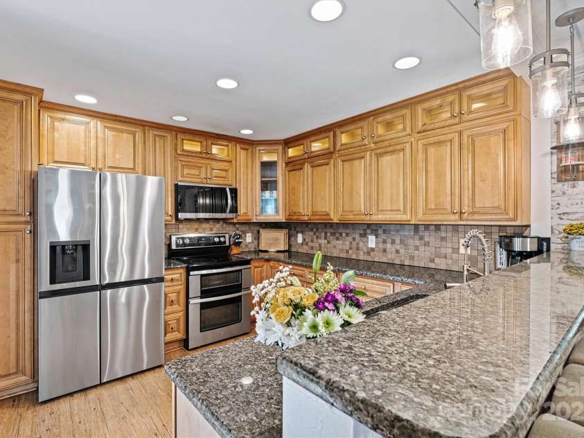 454 Eastway Drive, Troutman, NC 28166.  MLS# CAR4263950, YatesRealty ID 24330. Fabulous chef's kitchen with breakfast bar and updated appliances.