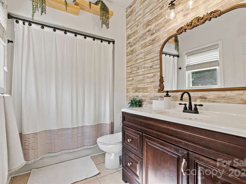 454 Eastway Drive, Troutman, NC 28166.  MLS# CAR4263950, YatesRealty ID 24330. Remodeled full bath on the main level.
