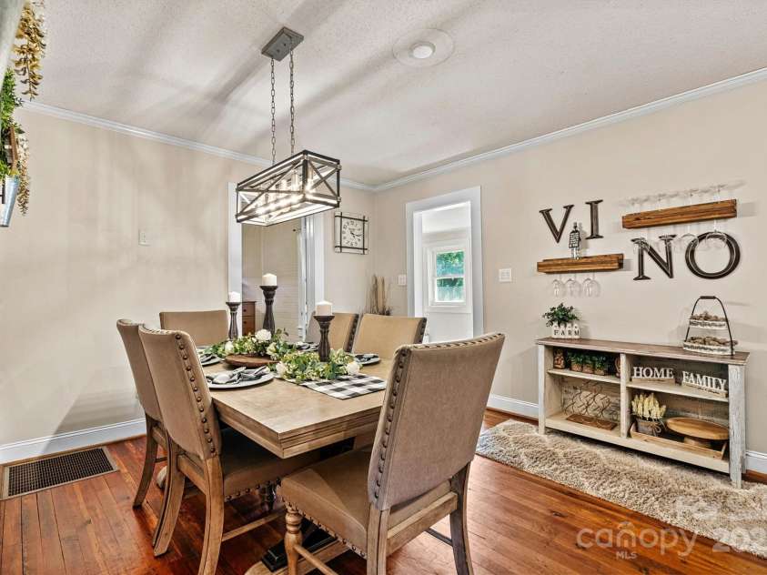 454 Eastway Drive, Troutman, NC 28166.  MLS# CAR4263950, YatesRealty ID 24330. Spacious dining area with beautiful wood flooring.