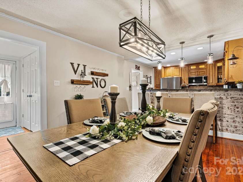 454 Eastway Drive, Troutman, NC 28166.  MLS# CAR4263950, YatesRealty ID 24330. Spacious dining area with beautiful wood flooring.