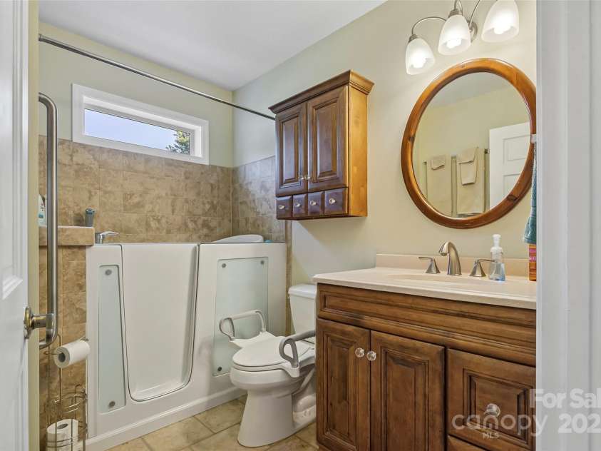 862 Asbury Road, Candler, NC 28715.  MLS# CAR4275719, YatesRealty ID 24339. Bathroom with walk-in / bathtub