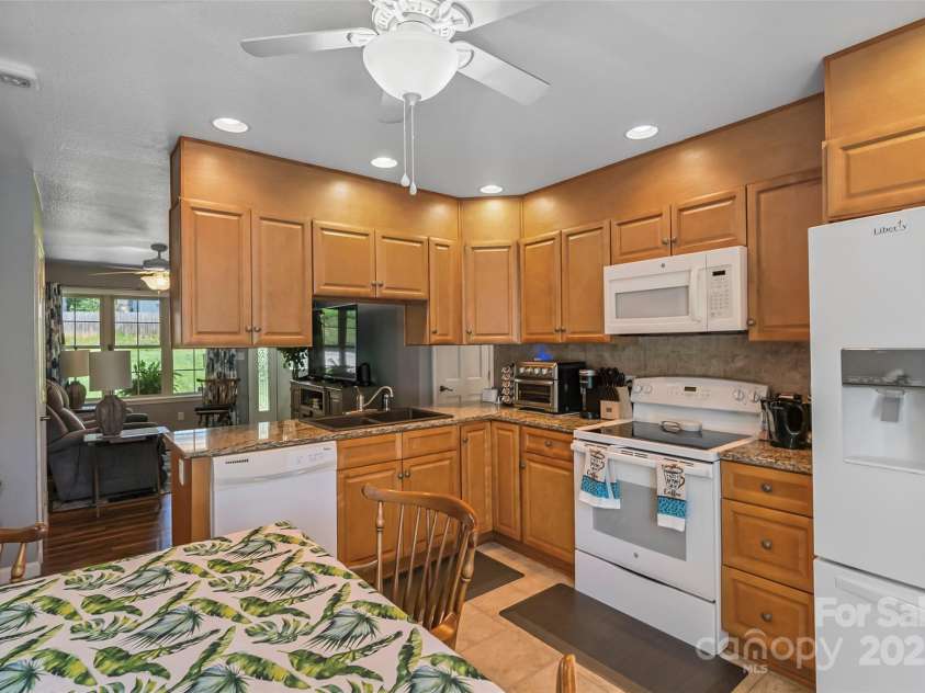 862 Asbury Road, Candler, NC 28715.  MLS# CAR4275719, YatesRealty ID 24339. Kitchen open into living space