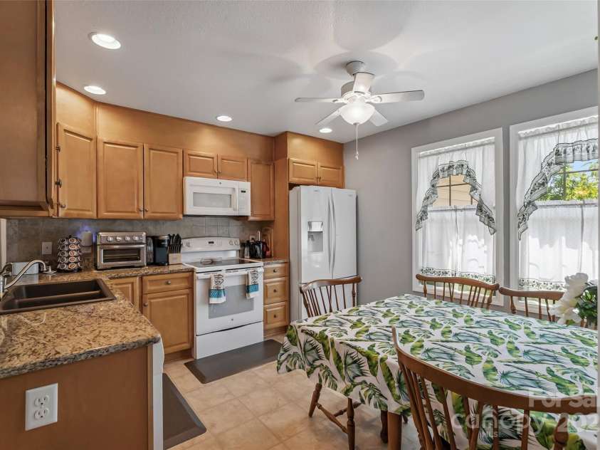 862 Asbury Road, Candler, NC 28715.  MLS# CAR4275719, YatesRealty ID 24339. Kitchen with dining area