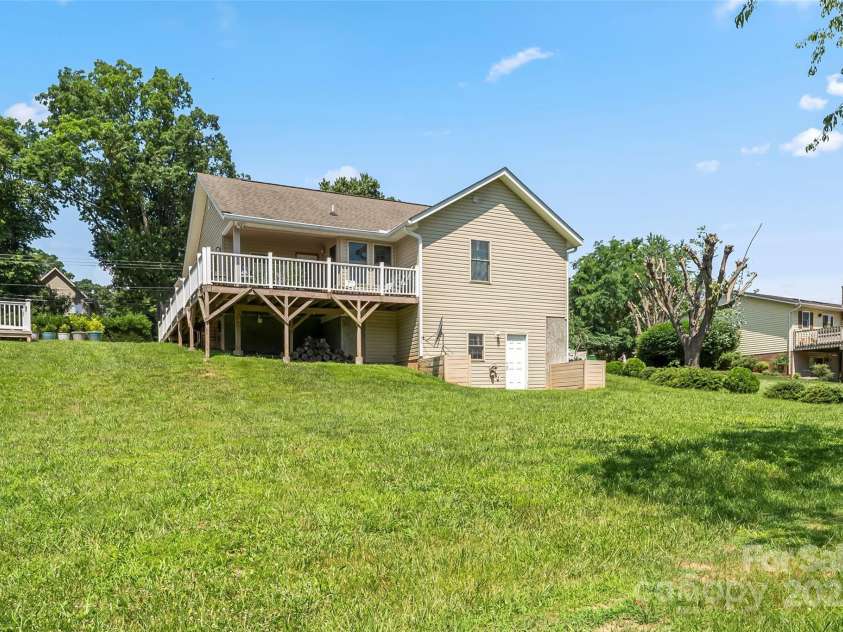 862 Asbury Road, Candler, NC 28715.  MLS# CAR4275719, YatesRealty ID 24339. Lush backyard