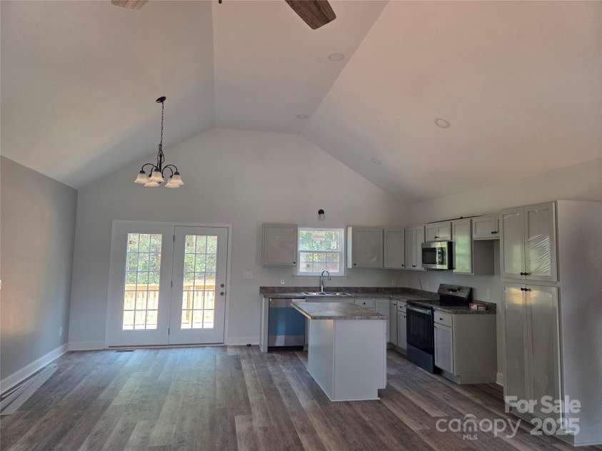153 Brook Creek Drive, Troutman, NC 28166.  MLS# CAR4274931, YatesRealty ID 24344. Vaulted livingroom/dining/kitchen