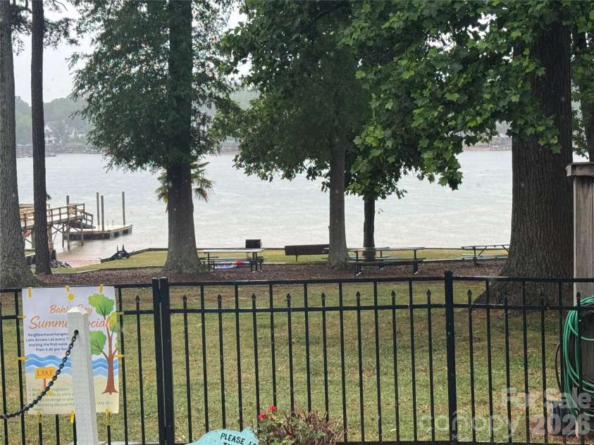 21205 Rio Oro Drive, Cornelius, NC 28031.  MLS# CAR4378603, YatesRealty ID 24353. Community lake access with dock, ramp and benches