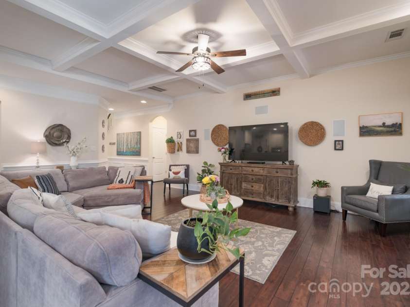 303 Ridge Reserve Drive, Clover, SC 29710.  MLS# CAR4232710, YatesRealty ID 24358. Family room showcasing a beautiful coffered ceiling and cozy gas fireplace.