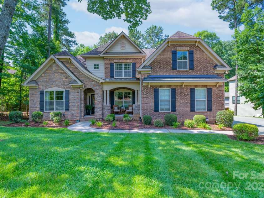 303 Ridge Reserve Drive, Clover, SC 29710.  MLS# CAR4232710, YatesRealty ID 24358. Stunning custom-built home framed with lush botanicals
