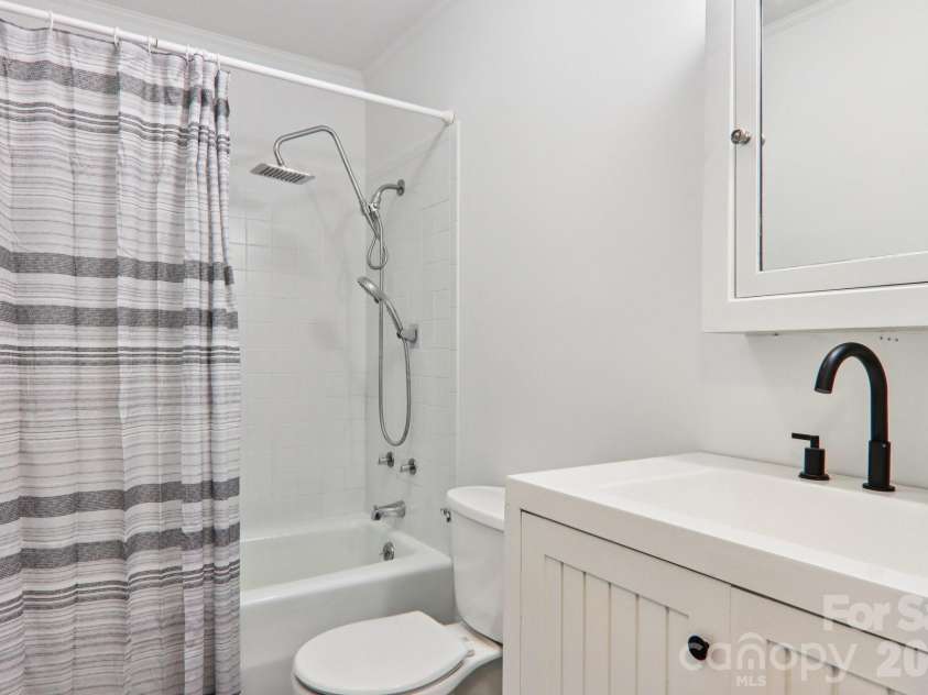 591 Blue Ridge Road, Black Mountain, NC 28711.  MLS# CAR4320573, YatesRealty ID 2436. Bath with shower and tub